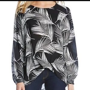 Karen Kane palm printed black long sleeve twist hem blouse.